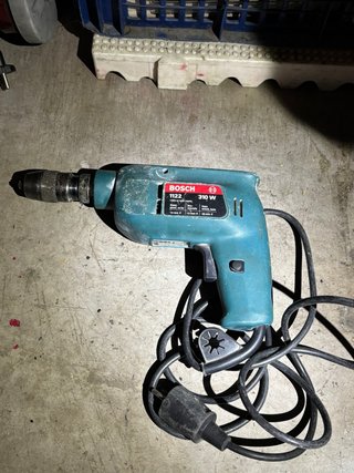 Taladro Bosch 1122 310W + brocas