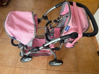 Cochecito doble de juguete rosa