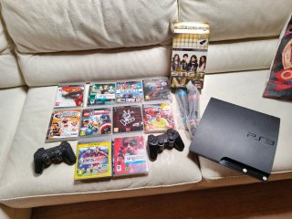 Consola PS3 Slim + Mandos, Micrófonos + Juegos