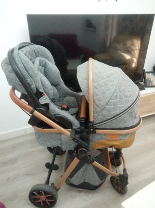 Carrito de bebé con silla y capazo