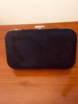 Bolso de mano azul marino de terciopelo