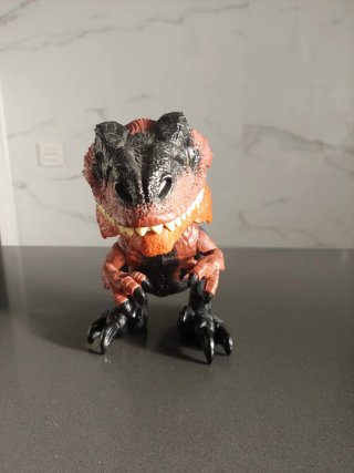Dinosaurio de juguete rojo y negro Con sonido