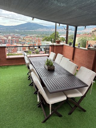 Mesa de teca y 10 sillas con cojines