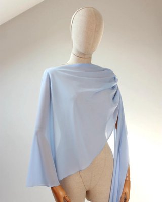 Capa asimétrica azul claro - Talla única. Nuevo