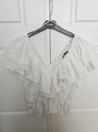 Top de volantes blanco Zara Talla L