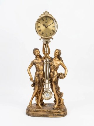 Reloj de sobremesa vintage dorado con figuras clás
