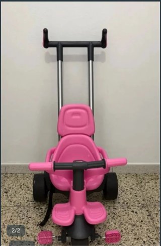 Triciclo rosa para bebé con manillar