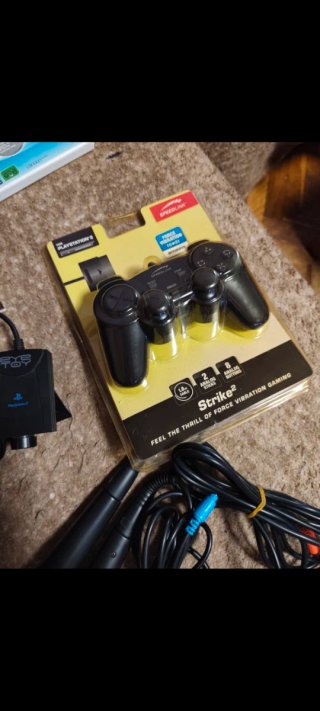 Consola PlayStation 2 (PS2) con juegos y accesorio