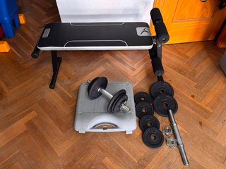 Lote Pesas Domyos 10kg con banco de abdominales .