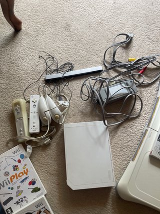 Consola Wii con plataforma y juegos