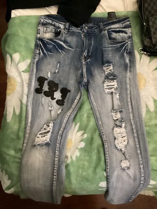 Jeans strappati uomo taglia 46