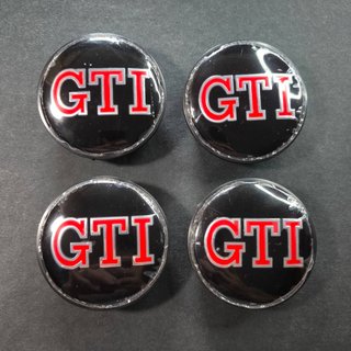 TAPABUJES VW GTI 65mm NEGROS - EMBLEMA VOLKSWAGEN