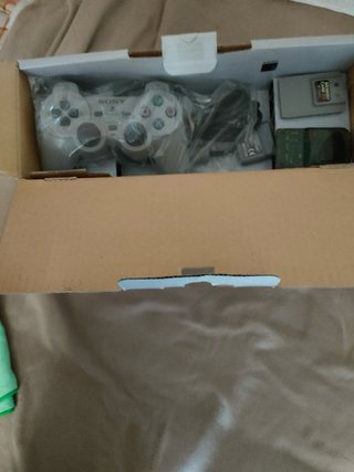 Consola PlayStation 1 (PSX) en su caja