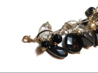 Pulsera piedras naturales negra y dorada