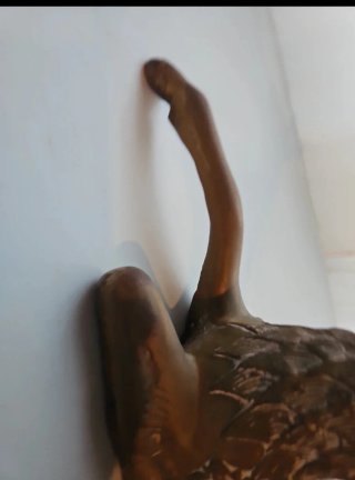 Figura ciervo bronce sentado