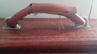 Maleta antigua de cuero marrón
