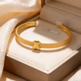 Pulsera rígida dorada tipo Tous