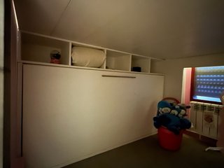 Habitación castillo infantil con tobogán