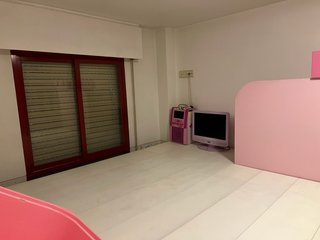 Habitación castillo infantil con tobogán
