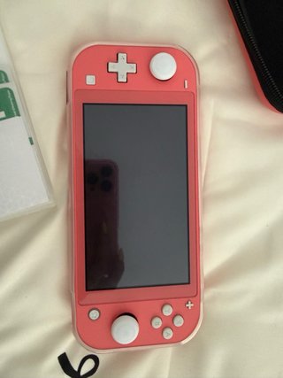 Nintendo Switch Lite Coral + fundas