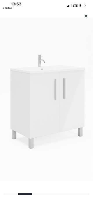 Mueble de baño blanco con lavabo