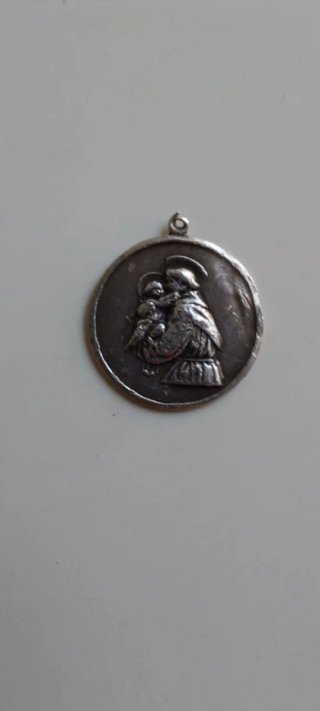Antigua medalla de plata