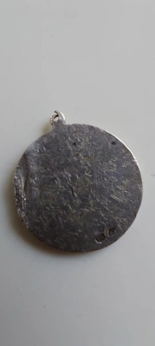Antigua medalla de plata
