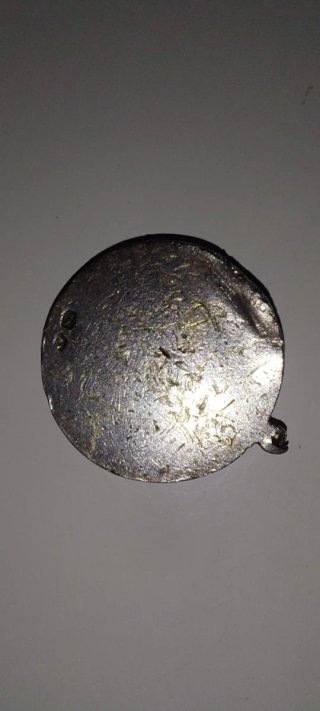 Antigua medalla de plata