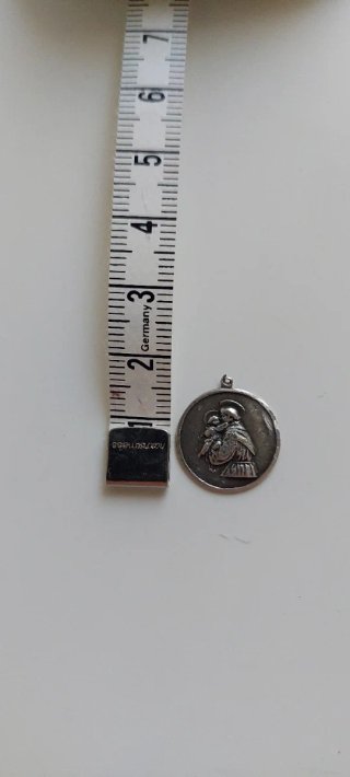 Antigua medalla de plata