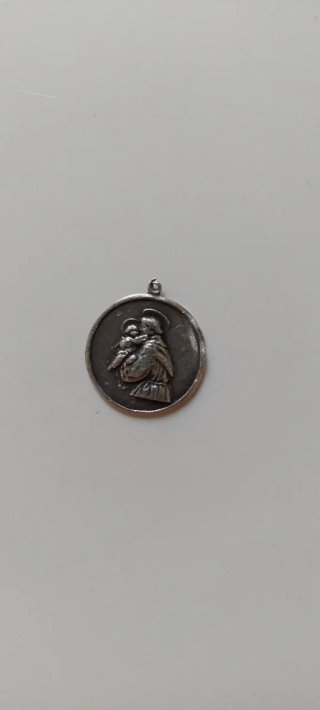 Antigua medalla de plata