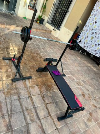 Banco de pesas y barra con discos