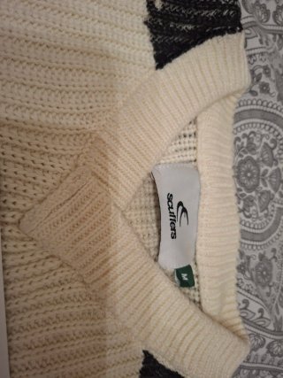 Jersey de punto beige y negro