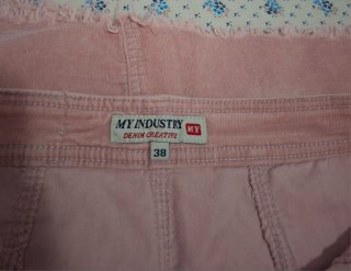 Falda de pana rosa con bolsillos