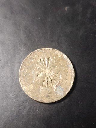 Moneda 1 Peseta con marca de la falange.