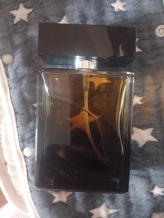 Perfume Negro y Dorado con Estrellas