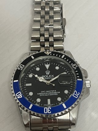 Reloj azul y negro Mas info md