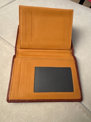 Cartera de mano de cuero marrón