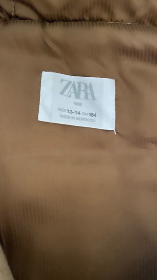Trenca beige con capucha y pelo