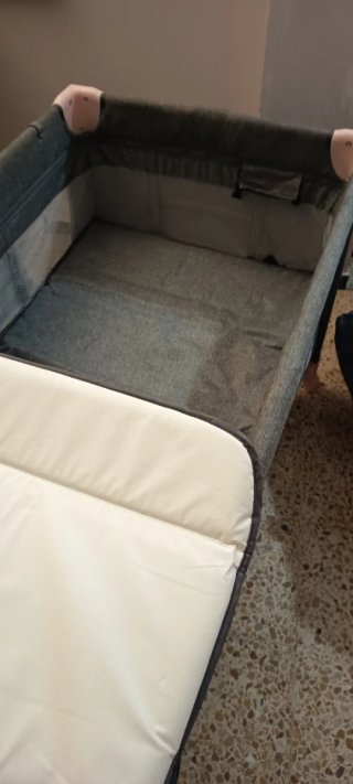 Cuna de viaje y mecedora