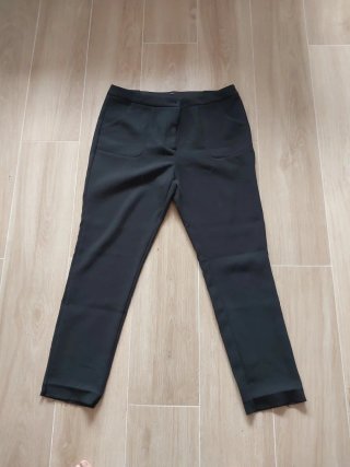 Pantalón vestir elástico dobladillo suelto