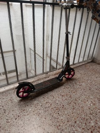Patinete Oxelo con ruedas rosas