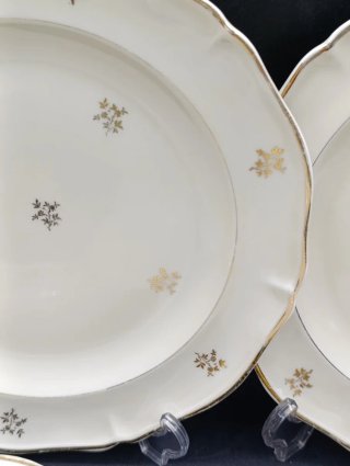 Set de platos Limoges crema y dorado