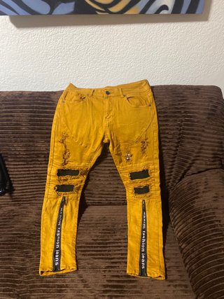 Pantalones vaqueros rotos amarillos hombre