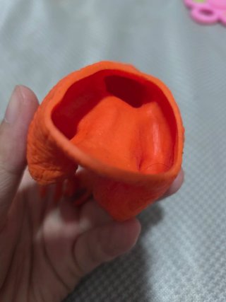 Marioneta Dinosaurio Naranja de Goma