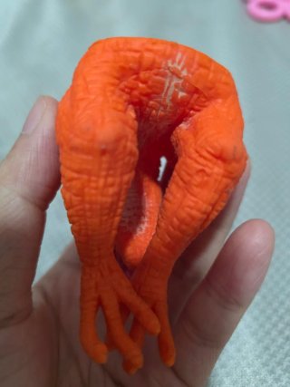 Marioneta Dinosaurio Naranja de Goma