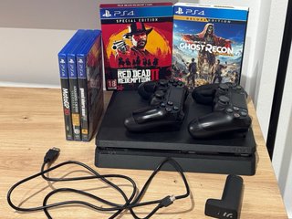 Playstation 4 de 1TB + 2 mandos + 5 juegos