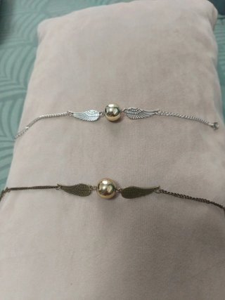 Pulsera snich dorada de Harry Potter.