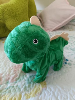 Dinosaurio de peluche interactivo