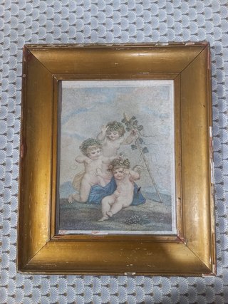 Cuadro de cupidos en marco dorado