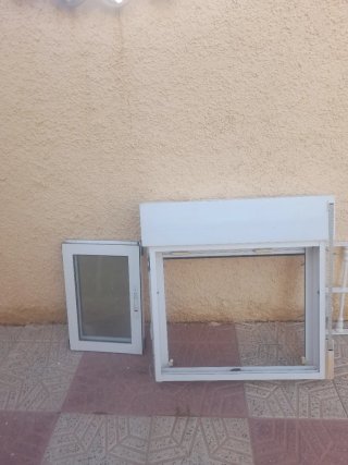 Ventana de aluminio y reja deHierro Blanca